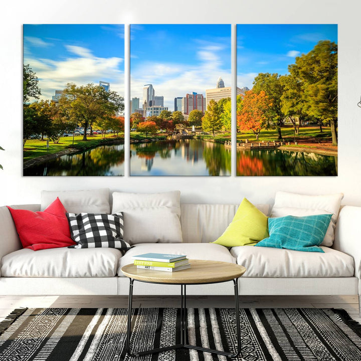 The Charlotte City Park at Spring Skyline Cityscape View wall art canvas print is a triptych featuring a scenic park with a lake and city skyline. It is gallery-wrapped on museum-quality canvases.