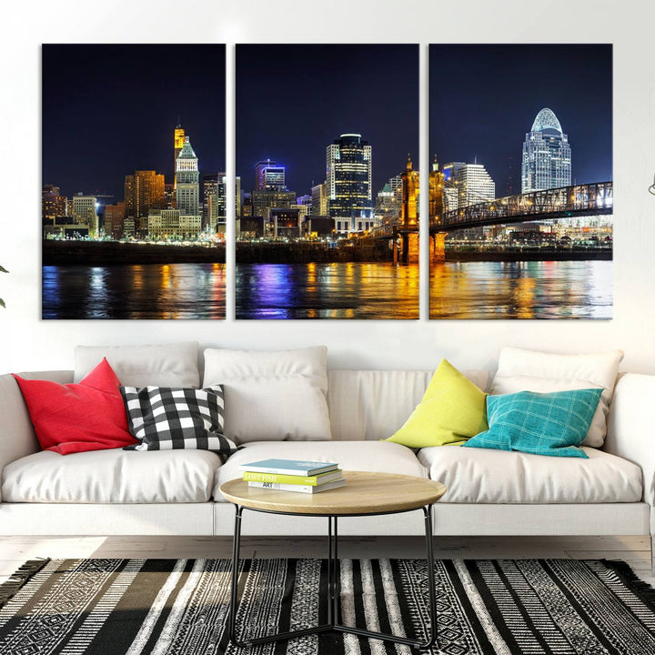 The Cincinnati City Lights Night Skyline Cityscape View Wall Art Canvas Print, crafted on museum-quality canvas with UV-protective coating and ready to hang, adds a touch of sophistication to the wall.