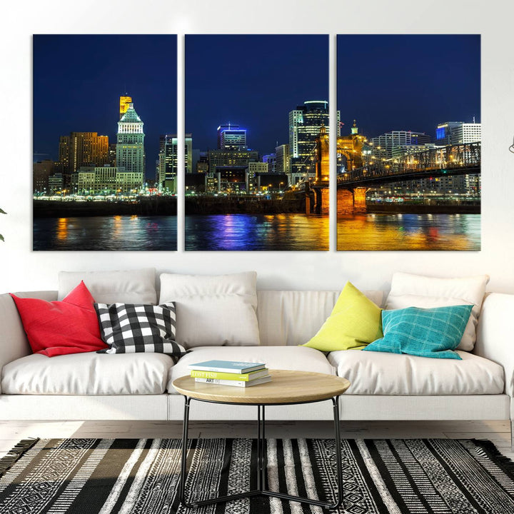 The "Cincinnati City Lights Night Skyline Cityscape" canvas print, displayed above a sofa, exhibits museum-quality craftsmanship with a UV-protective coating.