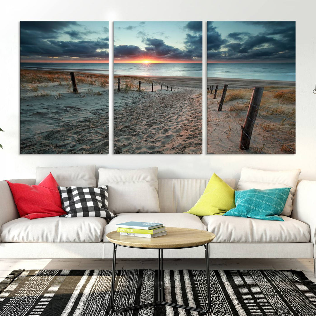 The modern living room features the Cloudy Weather Sunset Beach Wall Art Canvas Print. This museum-quality canvas adds a touch of sophistication with its hand-assembled framed art, ensuring lasting elegance. Enjoy free shipping on this exquisite piece.