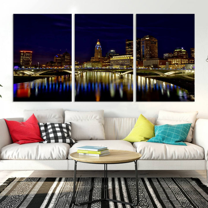 The "Columbus City Lights Night Skyline Cityscape View Wall Art Canvas Print" showcases a stunning city skyline at night, with illuminated buildings and bridges reflecting in the river, on a museum-quality canvas ready to hang.