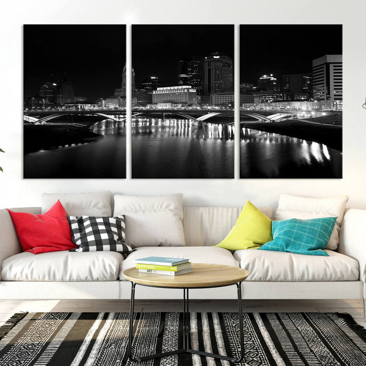 The living room features the "Columbus City Lights Skyline Black and White Wall Art Cityscape Canvas Print" above a coffee table. This artwork is presented as a triptych on museum-quality canvases with UV-protective coating.