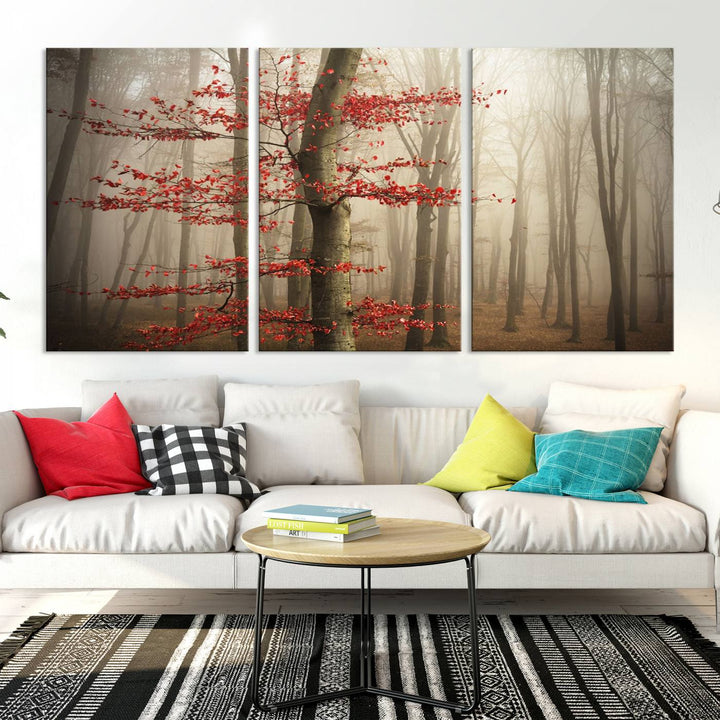 The living room features the Foggy Forest Wall Art, an Autumn Trees Canvas Print that showcases a serene nature scene with foggy woodland decor and a tree adorned in vibrant red leaves.