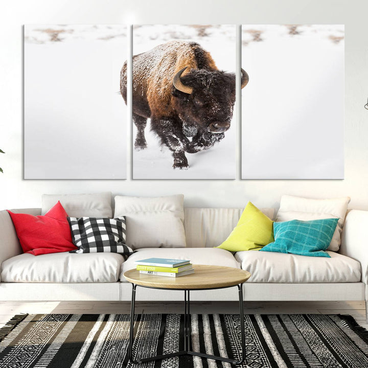 The Bison Winter Wall Art Canvas Print for Farmhouse Decor is displayed as a triptych in the living room. This artwork, printed on museum-quality canvases with a UV-protective coating to maintain its vibrant colors, is the focal point of the space.