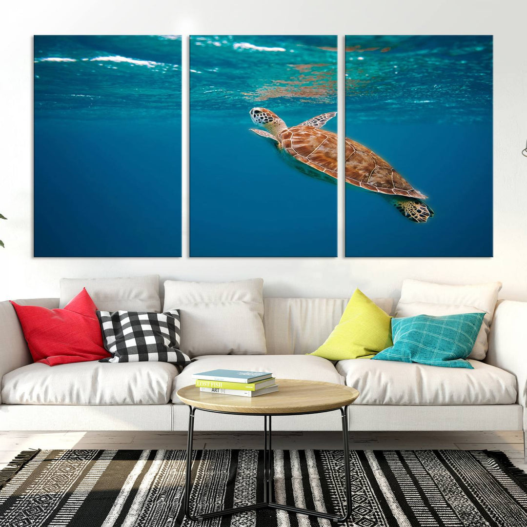 The living room features the "Baby Turtle in Ocean" wall art canvas print. This gallery-quality piece, depicting a sea turtle swimming underwater, adds an elegant touch to the space.