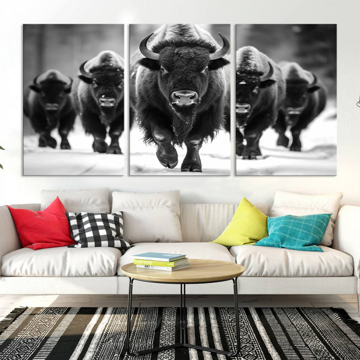 A modern living room features a striking black-and-white American Bison Art | Buffalo Herd Wall Art Canvas Print on the wall.