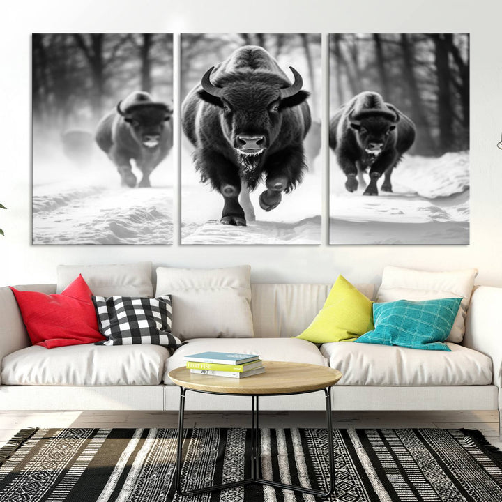 Transform your living room with the Buffalo Wall Art Canvas Print triptych, showcasing a bison family in motion across a snowy landscape. This striking Western decor piece becomes the focal point of any room.