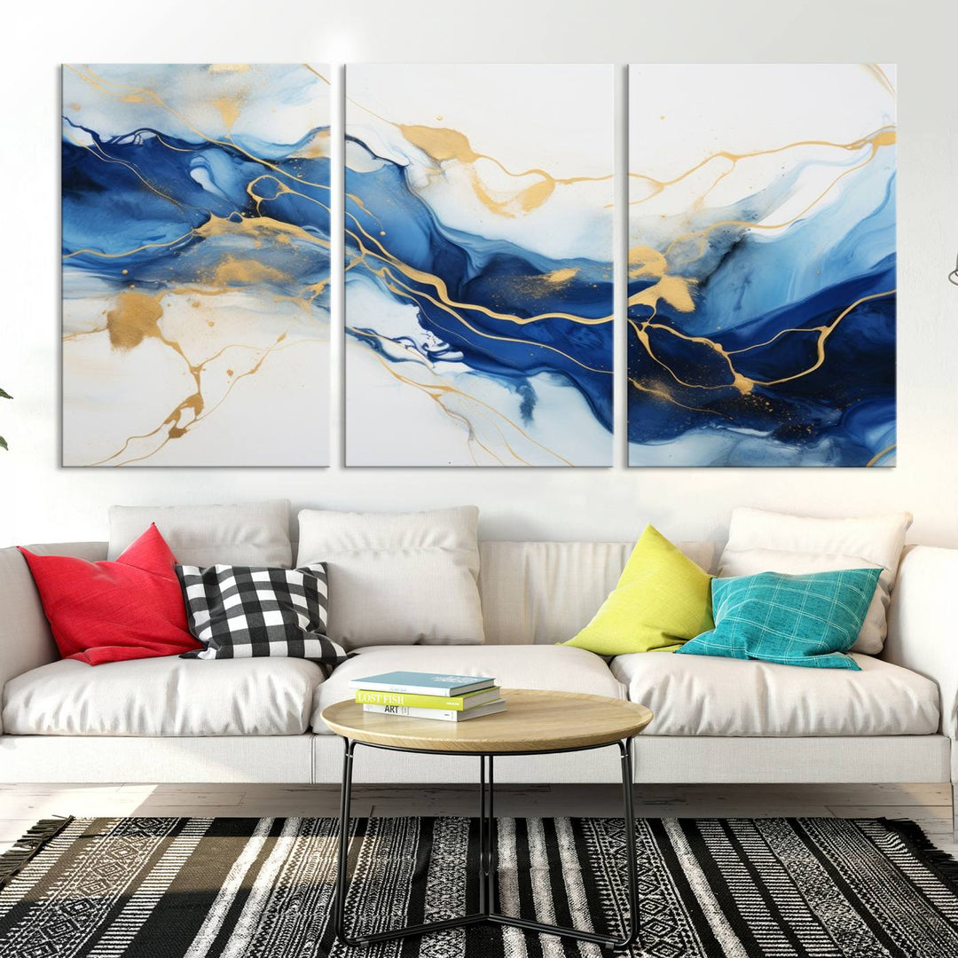 The Blue Abstract Wall Art is displayed as a triptych on museum-quality canvas, showcasing a blue and gold abstract design. The artwork includes a UV-protective coating to maintain its vibrancy and comes with the benefit of free shipping.