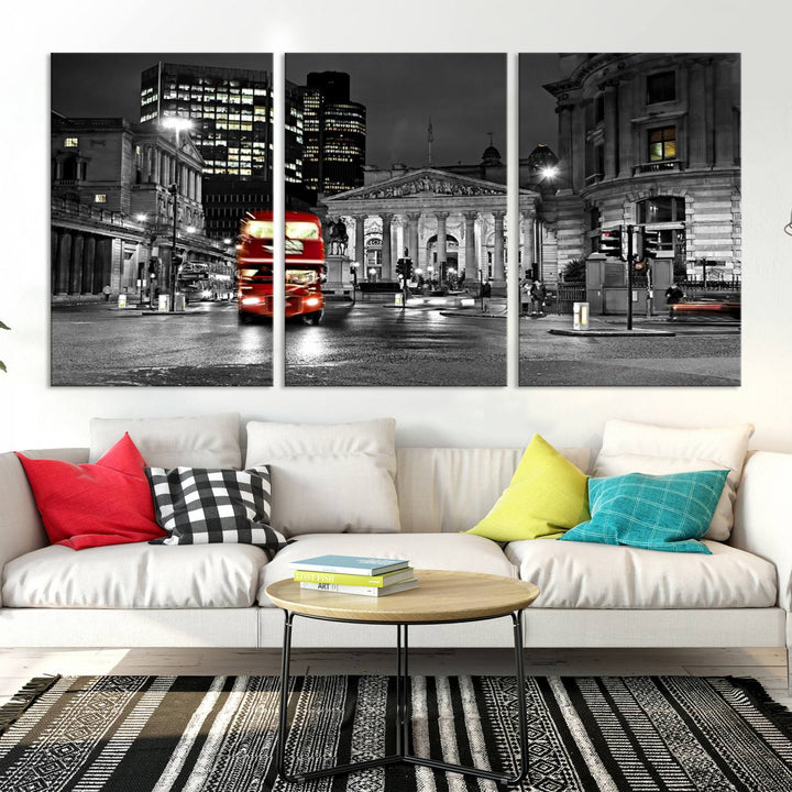 The London Night Red Bus Wall Art Canvas Print features a black and white cityscape with a moving red double-decker bus, crafted on museum-quality canvas with a UV-protective coating. This ready-to-hang artwork is designed to stand out and enhance any space.