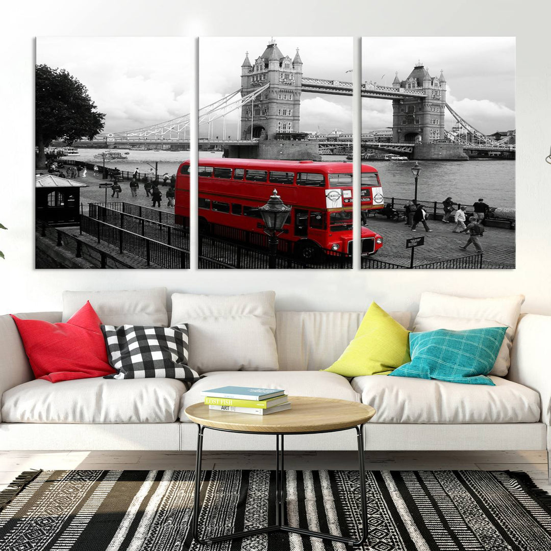 The London Red Bus and Bridge Wall Art Canvas Print showcases a red London bus in front of Tower Bridge, beautifully presented as a gallery-wrapped canvas. This striking image is divided into three panels, delivering a museum-quality display that's ready to hang.