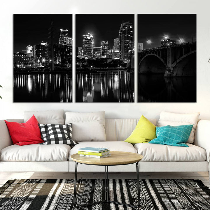 The "Minneapolis Wall Art Canvas Print, Minnesota City Wall Art Print, Minnesota Cityscapes Wall Art" features a black and white triptych of a city skyline with a bridge. Crafted on museum-quality canvas, this gallery-wrapped artwork is finished with a UV-protective coating to ensure lasting beauty.