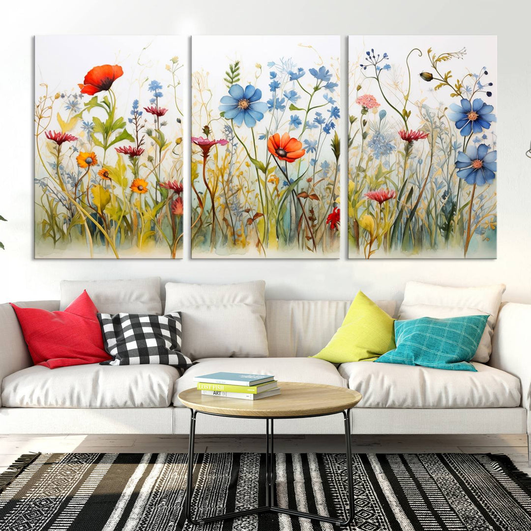 The Colorful Wildflower Canvas Wall Art – Vibrant Floral Botanical Print, consisting of a large 3 panel set, adds bright nature decor to the living room against a black wall.