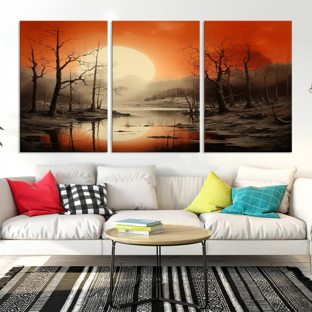 The "Abstract Watercolor Trees and Sunset on Lake Wall Art" is a triptych masterpiece, showcasing an orange-hued landscape of barren trees and a large sun. Displayed on museum-quality canvases with UV-protective coating, it creates a striking visual element in any space.