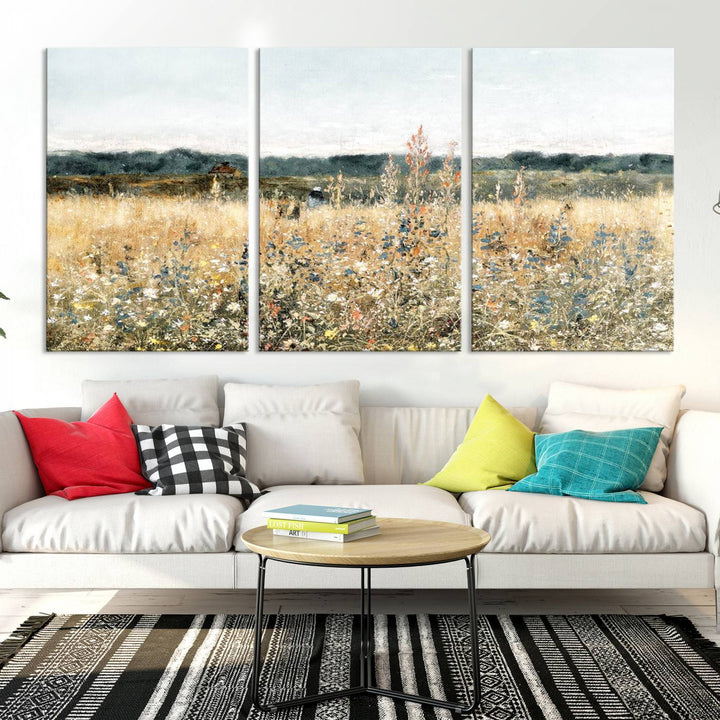 The "Wildflower Field Wall Art Canvas" brings rustic charm to the room with its nature-inspired landscape print, making it a perfect addition to the living room or office.