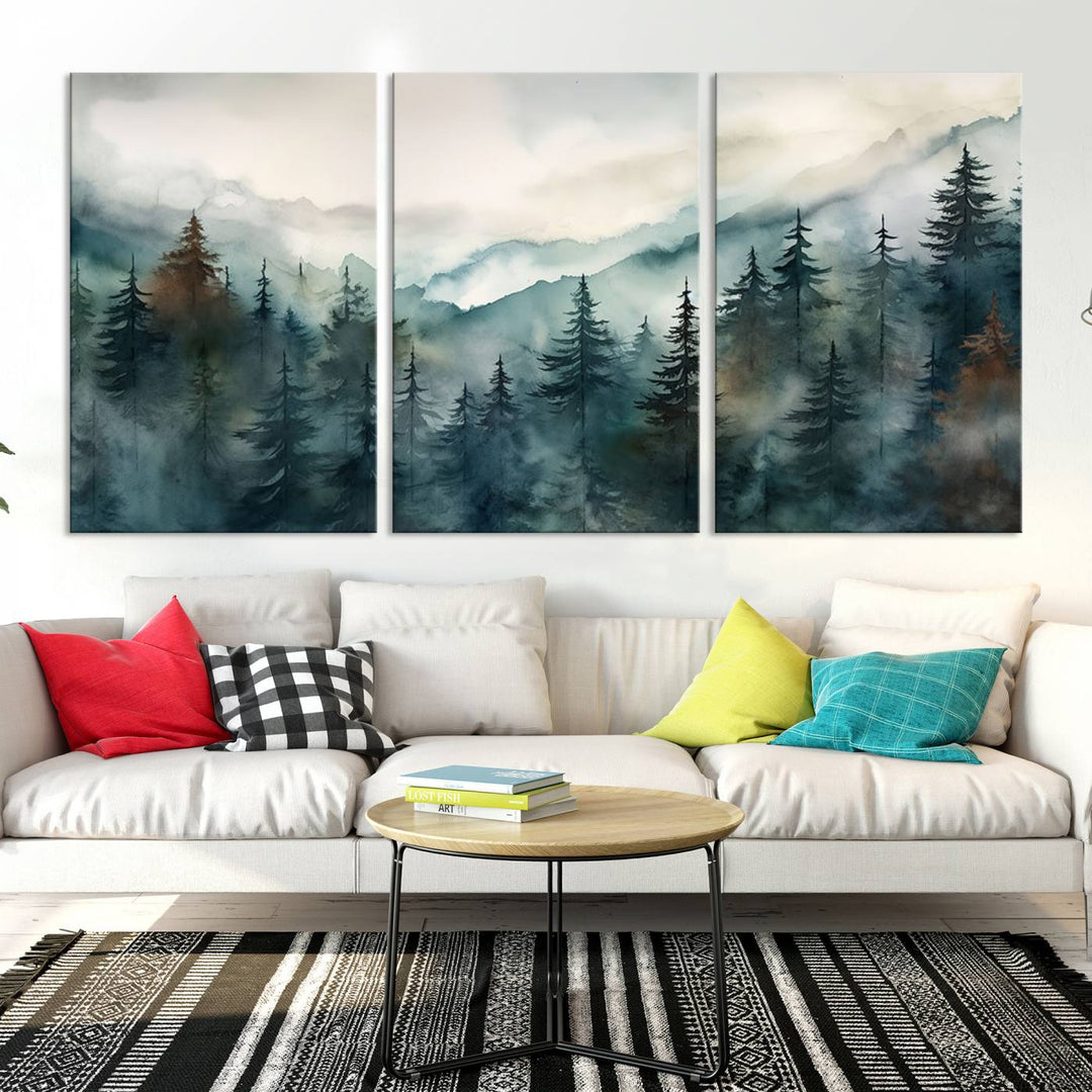 A contemporary living room features a triptych of the Serenity Forest Wall Art Canvas—a captivating display of nature-inspired woodland decor with stunning foggy mountain landscape prints.