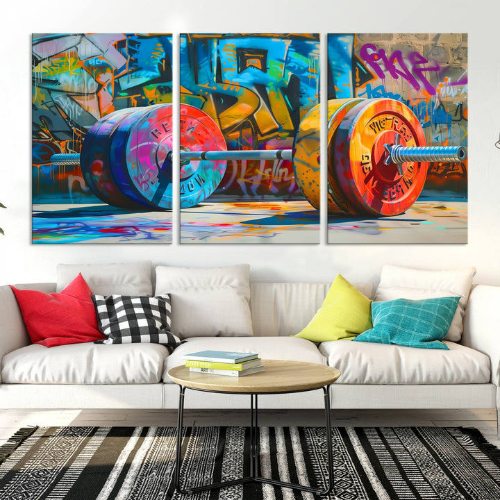 The Fitness Gym Barbell Graffiti Wall Art Canvas Print, a vibrant triptych featuring a barbell against a graffiti backdrop, elegantly hangs in the room. Crafted on premium canvas with a gallery-quality finish, this stunning piece of wall art effortlessly combines urban flair with sophisticated decor.