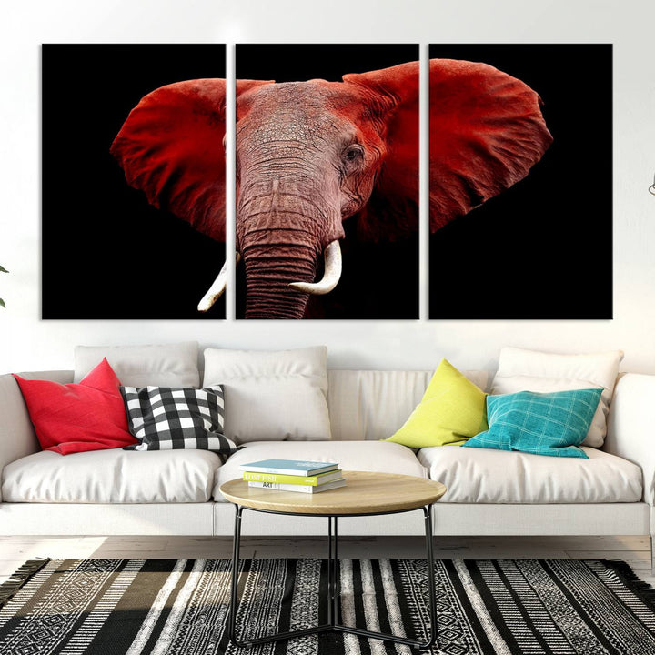 A Wall Art Canvas Print in the modern living room features a three-panel premium design of a red elephant face.