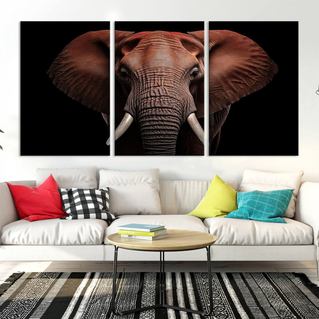 A stunning triptych titled "Wild Elephant Wall Art Canvas Print" beautifully enhances the wall above a contemporary living room. This Africa Savannah Wild Animal Wall Decor Print is of museum-quality, complete with a UV-protective coating to ensure its vibrancy and beauty are preserved for years.