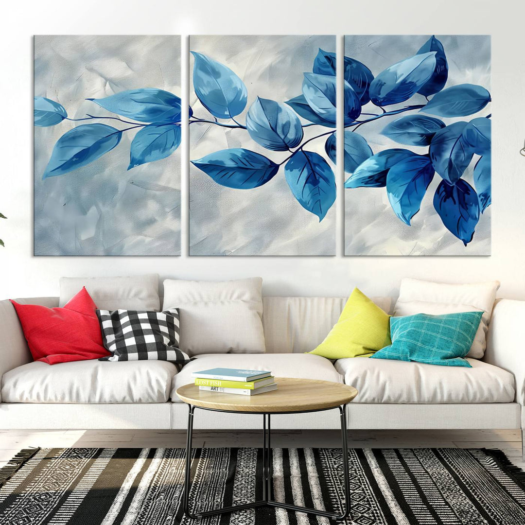 A Blue Leaf Abstract Wall Art Canvas Print, featuring a textured background and gallery-quality finish, is displayed.