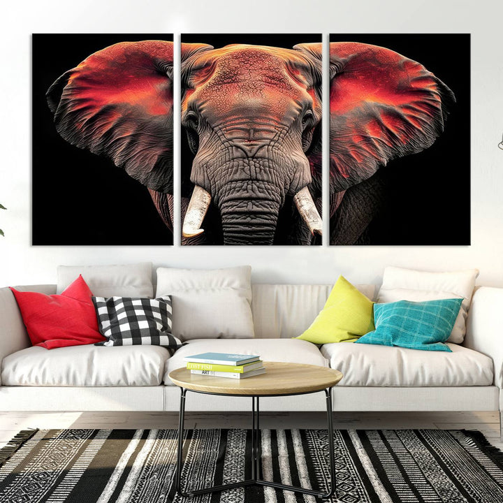 The Elephant Wall Art Canvas Print, featuring vibrant red and black tones, is a stunning artwork printed on museum-quality canvas. It comes with a UV-protective coating.