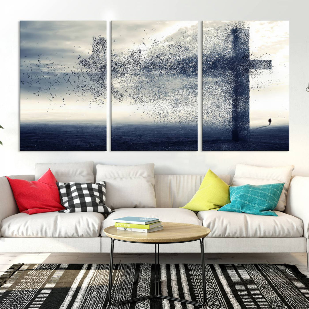 The "Jesus and the Fading Cross – Symbol of Faith" framed canvas print beautifully depicts a cross formed by birds against a moody sky above an ocean. This piece of Christian wall art infuses spirituality into the minimalist space.