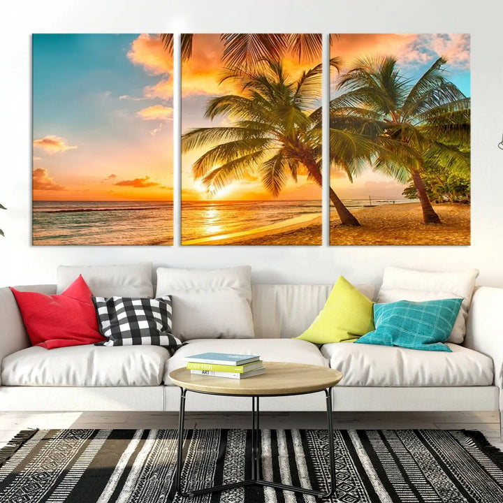 The Tropical Sunset Wall Art Print features a vibrant beach scene with palm trees and an ocean view highlighted by a golden sunset.