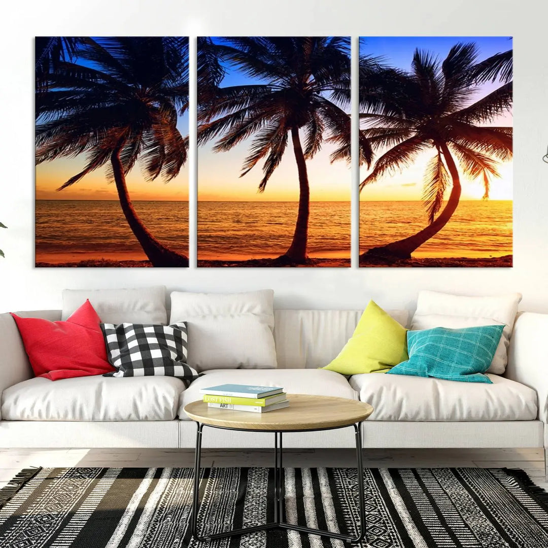 The living room features a wall adorned with the "Wall Art Canvas Curve Palms at Sunset on Beach," showcasing gallery-wrapped, museum-quality canvases in a stunning triptych.