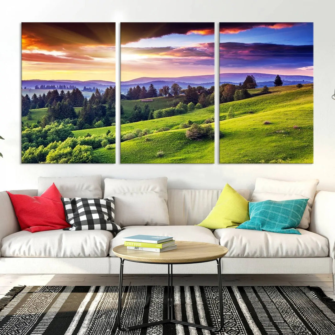 The room features a large triptych of the Green Hills and Sunset Wall Art Print, showcasing a scenic landscape with lush greenery and a vibrant sky.