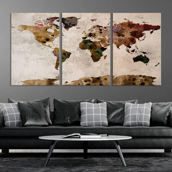 A Watercolor World Map Canvas Print, wrapped in an elegant gallery style, hangs on the wall.