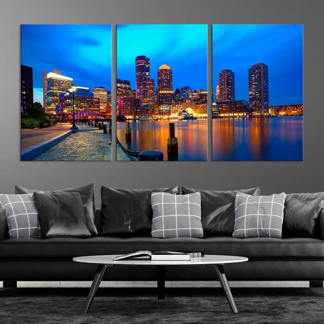 A triptych of the "Boston City Lights Night Blue Skyline Cityscape View Wall Art Canvas Print" adorns the wall. This museum-quality canvas artwork is ready to hang and includes a UV-protective coating for lasting brilliance.