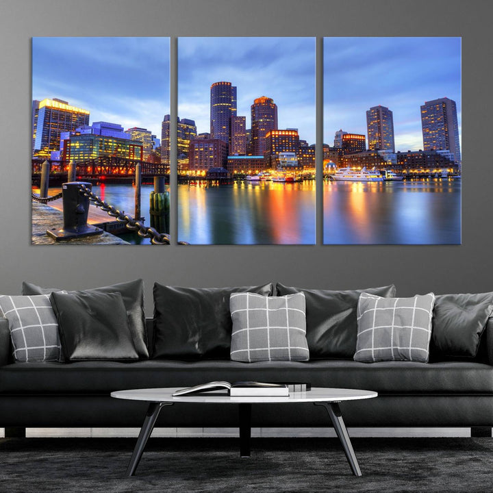 The Boston City Lights Sunset Cloudy Blue Skyline Cityscape View Wall Art Canvas Print embellishes a contemporary living room. This gallery-wrapped canvas set guarantees museum-quality canvases to enhance any space.