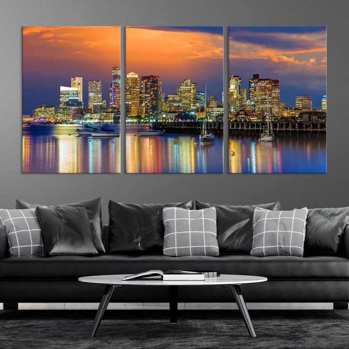 A contemporary dining area features a large triptych wall art of the Boston City Night skyline in blue and orange hues, printed on museum-quality canvases to ensure lasting beauty.