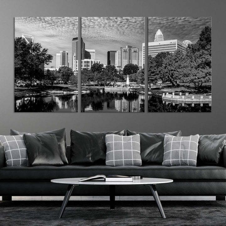 The living room features a captivating triptych titled "Charlotte City Cloudy Skyline Black and White Wall Art Cityscape Canvas Print," crafted on museum-quality canvas with UV-protective coating. Modern decor accentuates the dynamic scene.