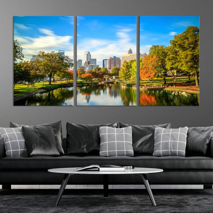 The Charlotte City Park at Spring Skyline Cityscape View wall art canvas print is a triptych featuring a scenic park with a lake and city skyline. It is gallery-wrapped on museum-quality canvases.