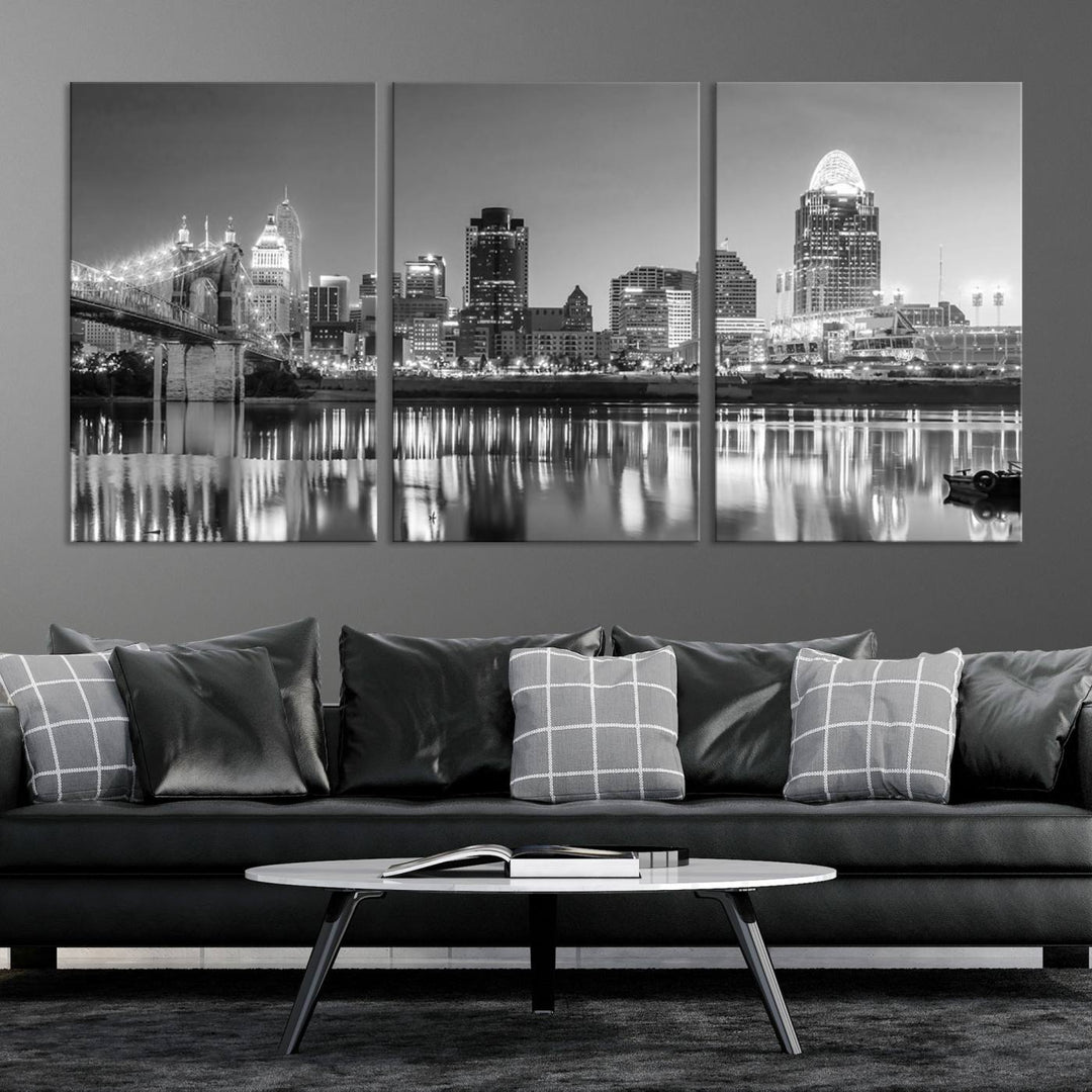 The "Cincinnati City Lights Skyline Black and White Wall Art Cityscape Canvas Print" is elegantly displayed in a stylish living room.