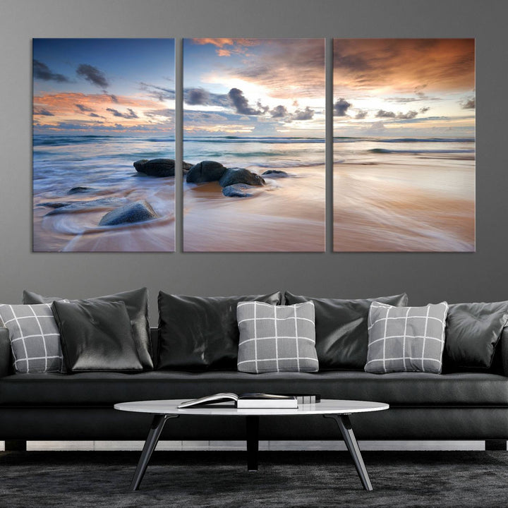 The "Serene Weather On The Beach Wall Art Canvas Print," featuring a tranquil beach scene with rocks and waves, is ready to hang and enjoy.