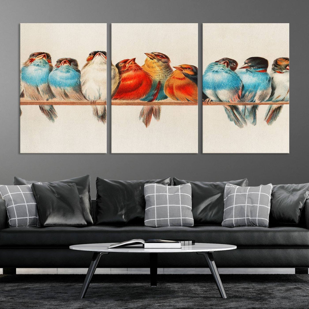 The Abstract Birds Wall Art Canvas Print, featuring a triptych of colorful birds perched on a branch, is printed on museum-quality canvas and equipped with a UV-protective coating and ready-to-hang design. This artwork adds vibrant elegance to your living space.