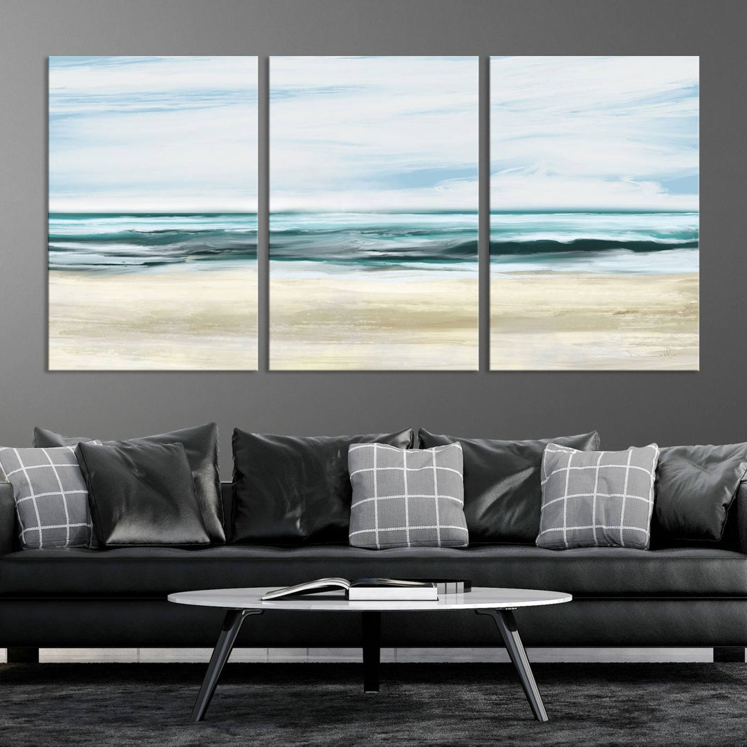 The room features the Ocean Abstract Wall Art Canvas Print, a triptych beach painting on museum-quality canvas with a gallery-wrapped finish and UV-protective coating.