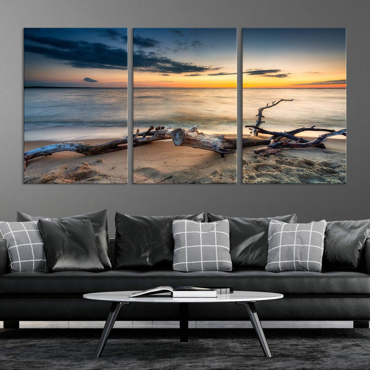 A captivating piece of Ocean Sunset Beach Wall Art Canvas Print, gallery wrapped, graces the gray wall.