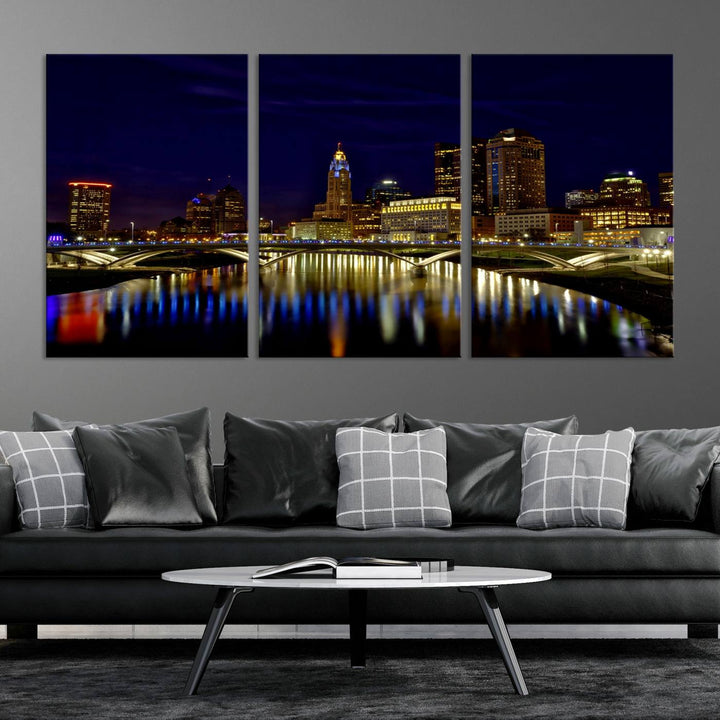 The "Columbus City Lights Night Skyline Cityscape View Wall Art Canvas Print" showcases a stunning city skyline at night, with illuminated buildings and bridges reflecting in the river, on a museum-quality canvas ready to hang.