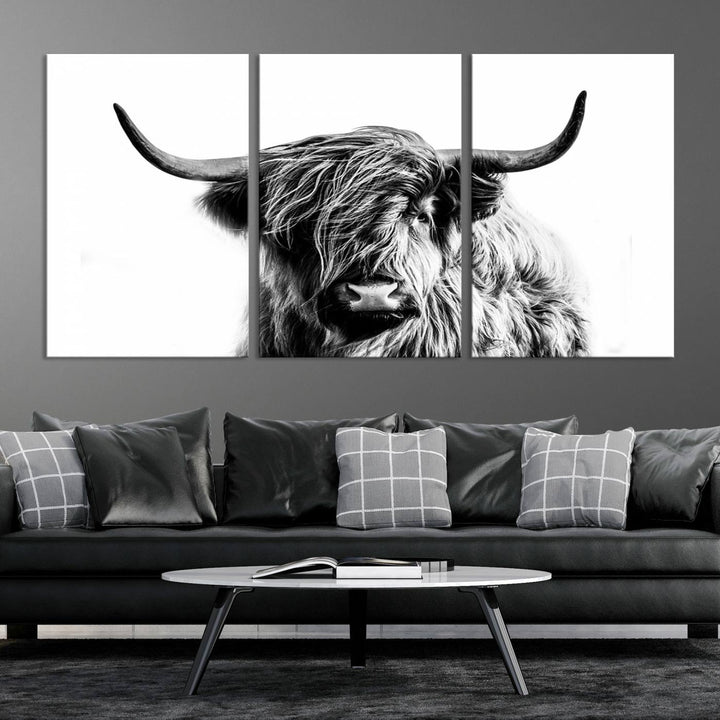 The Scottish Highland Cow Cattle Art Print Farmhouse Wall Art Canvas Print enhances rustic farmhouse decor with its depiction of a long-haired, large-horned cow. This triptych is an ideal choice for chic wall art.