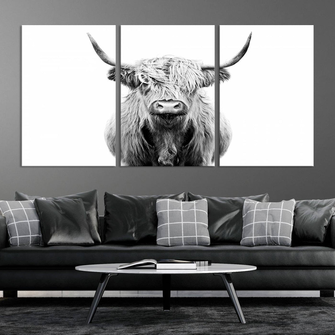 The wall art features a triptych of a Scottish Highland cow, printed on museum-quality canvases with a UV-protective coating. This decorative piece is known as the Highland Cow Canvas Wall Art Farm House Wall Art.