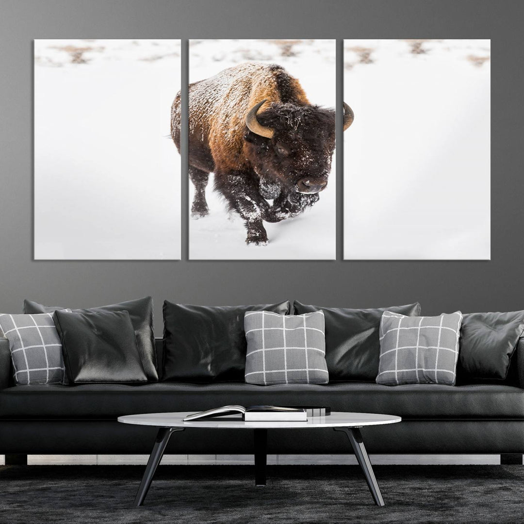 The Bison Winter Wall Art Canvas Print for Farmhouse Decor is displayed as a triptych in the living room. This artwork, printed on museum-quality canvases with a UV-protective coating to maintain its vibrant colors, is the focal point of the space.