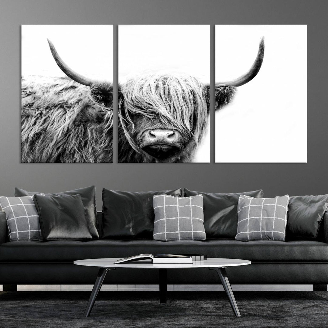 A museum-quality triptych titled "Black White Scottish Highland Cow Cattle Art Print Farmhouse Wall Art Canvas Print" embellishes the dark wall. The canvas is equipped with a UV-protective coating to ensure lasting vibrancy.