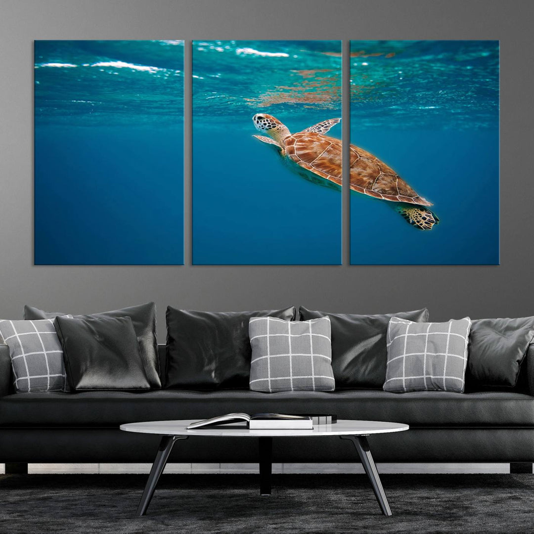 The living room features the "Baby Turtle in Ocean" wall art canvas print. This gallery-quality piece, depicting a sea turtle swimming underwater, adds an elegant touch to the space.