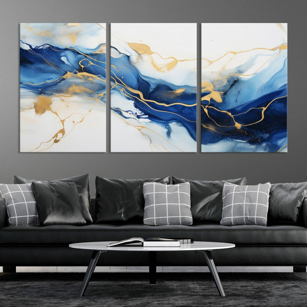 The Blue Abstract Wall Art is displayed as a triptych on museum-quality canvas, showcasing a blue and gold abstract design. The artwork includes a UV-protective coating to maintain its vibrancy and comes with the benefit of free shipping.