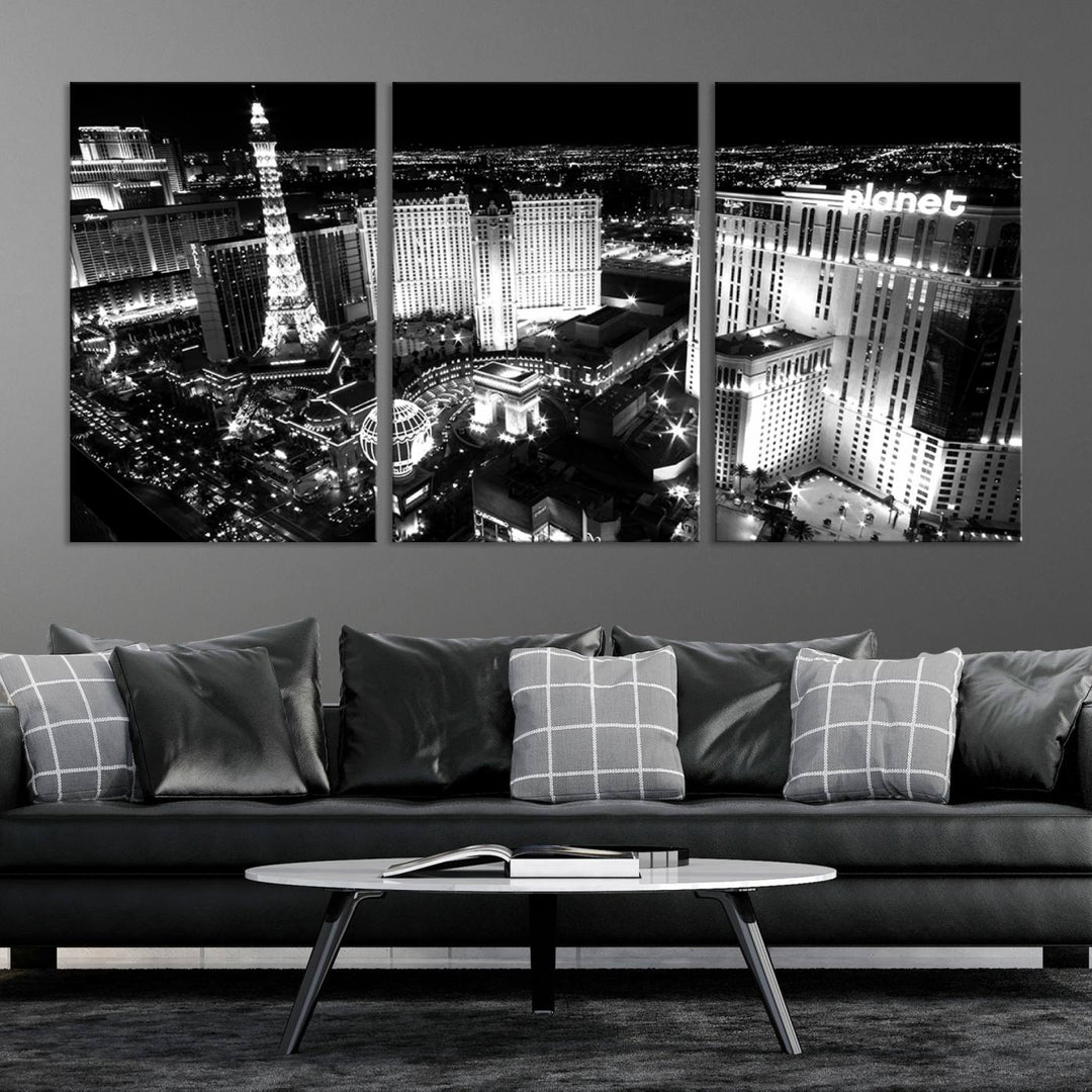 The Las Vegas Wall Art Canvas Print is a black and white triptych that showcases a city skyline at night. Crafted on museum-quality canvas with a UV-protective coating, it serves as an elegant and ready-to-hang focal point in the room.