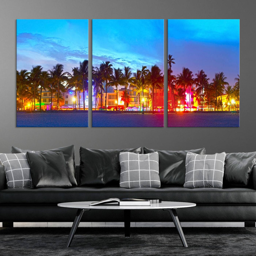 The living room features a three-panel Miami City Wall Art Canvas Print, showcasing a colorful, illuminated beach scene with palm trees on museum-quality canvas.