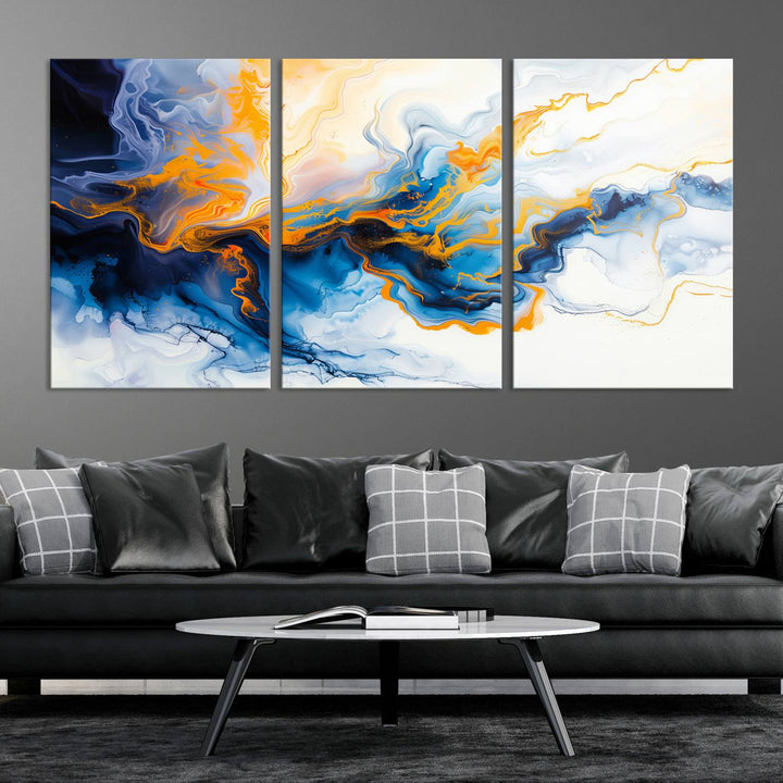 A stunning Fluid Alcohol Ink Wall Art with Gold Wall Art Canvas Print, featuring vibrant blue, orange, and white swirls, adorns the wall. This gallery-quality finish adds an exquisite touch to any living space.