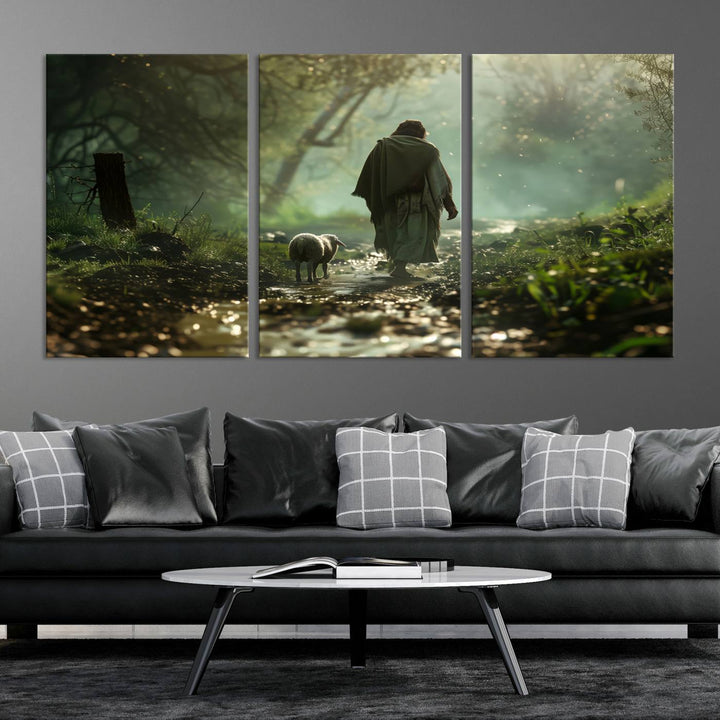 The wall art piece, titled "Jesus Shepherd a Lost Lamb Canvas Wall Art Print," is suspended on the wall and depicts a robed figure and a lamb wandering along a forest path.